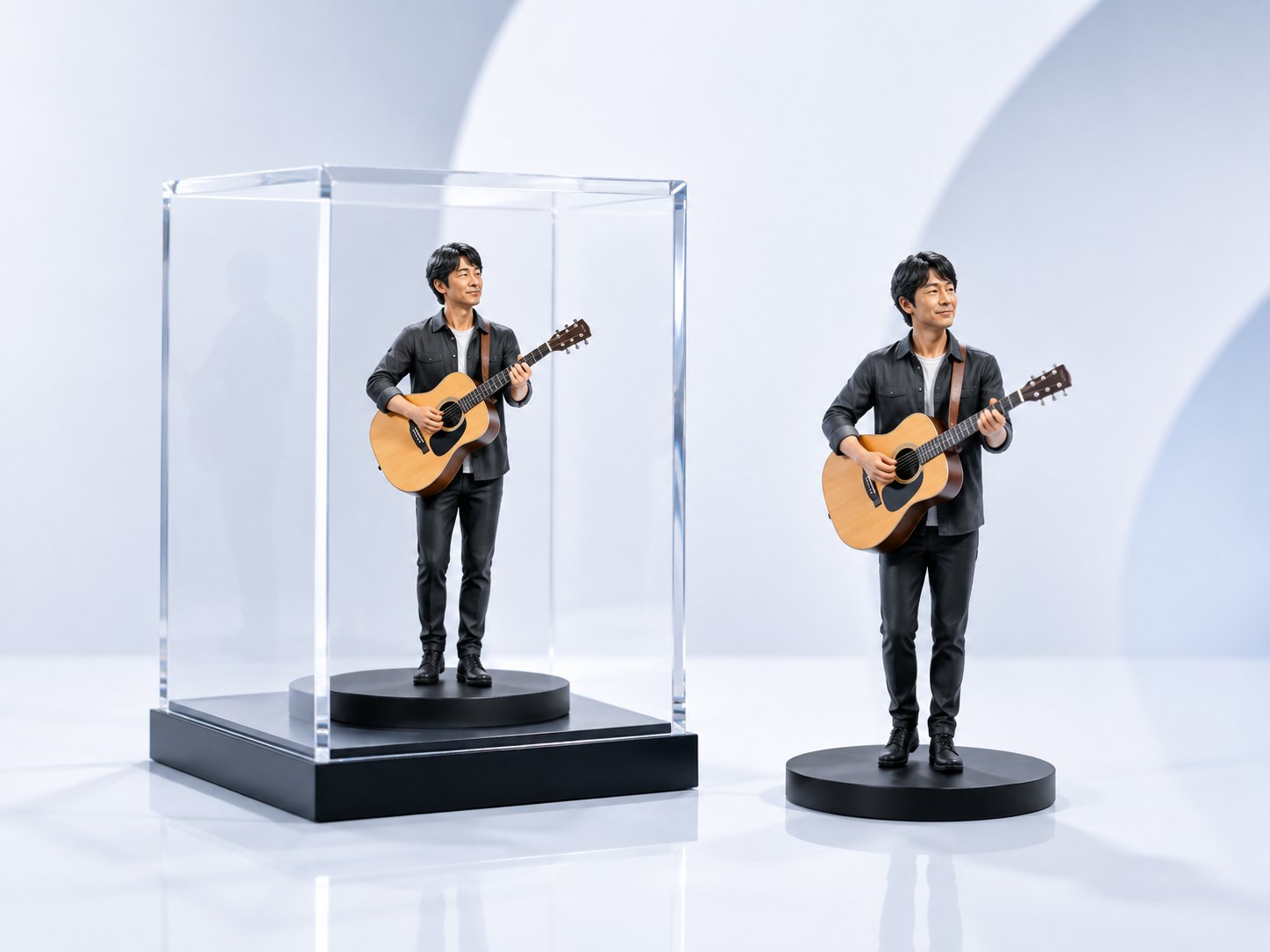 ギターを持つアーティストのフィギュアとアクリルケース
