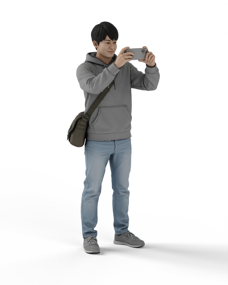 スマホで撮影する若者